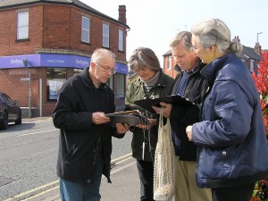 Eric Ashburner (left) and Lucy Care (right) collecting signatures to try to stopthe closure of the Derbyshire Building Society (in the background).